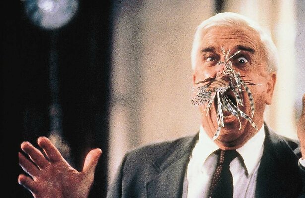 Leslie Nielsen in The Naked Gun: From the Files of Police Squad!